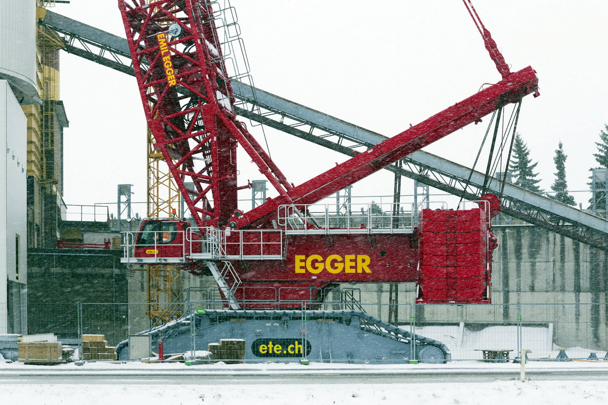 Liebherr LR 11000 crawler crane installs a silo for a Liebherr concrete mixing plant